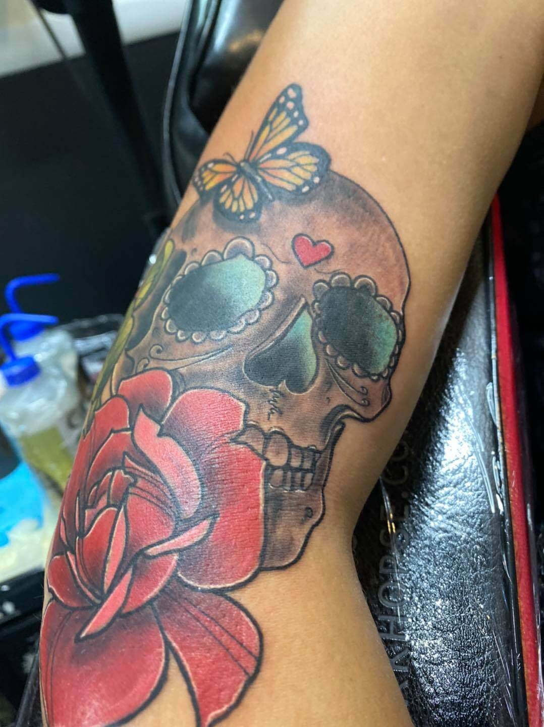 skull with a flower tattoo