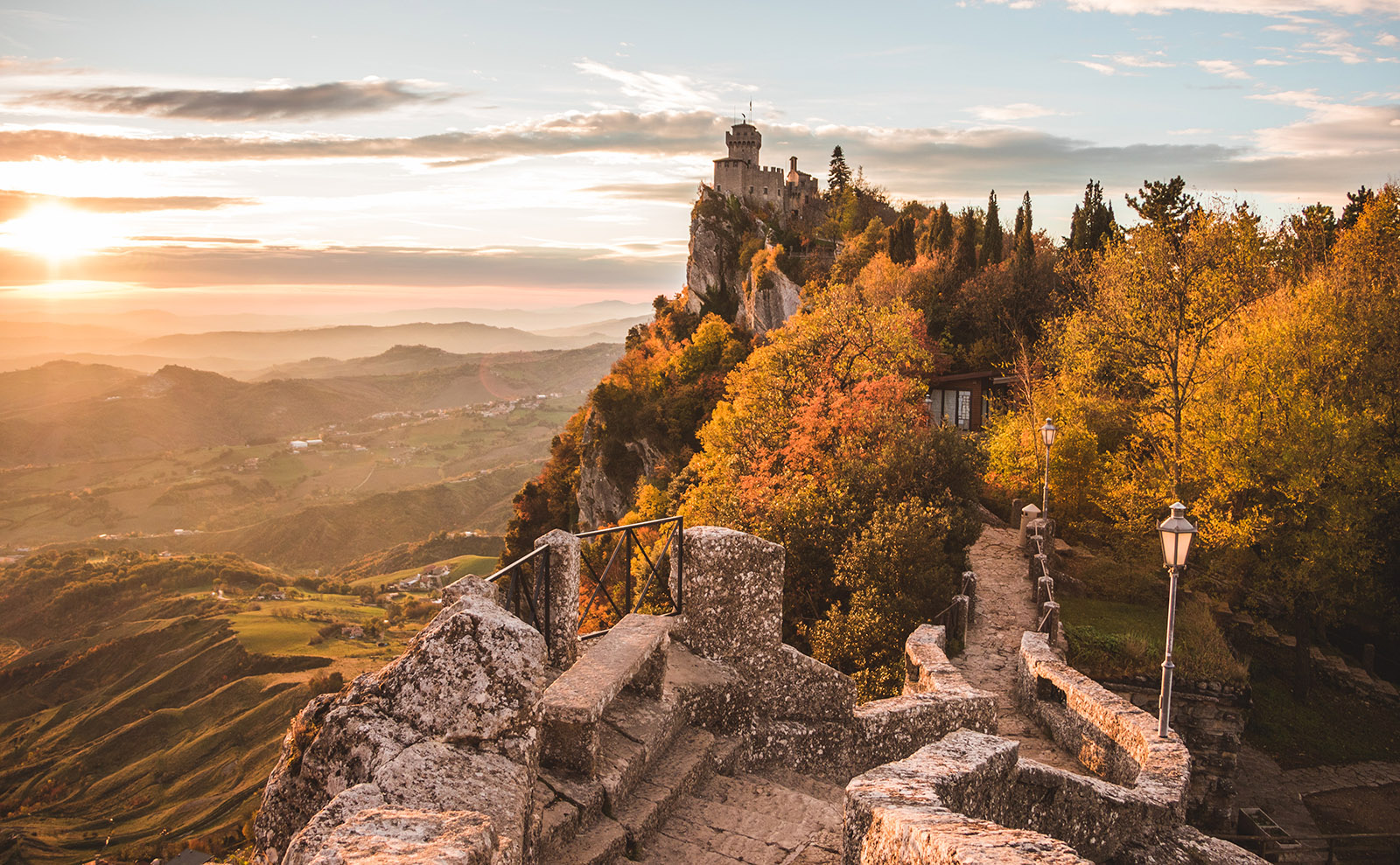  castle on a hill in san marino overlooking the forest