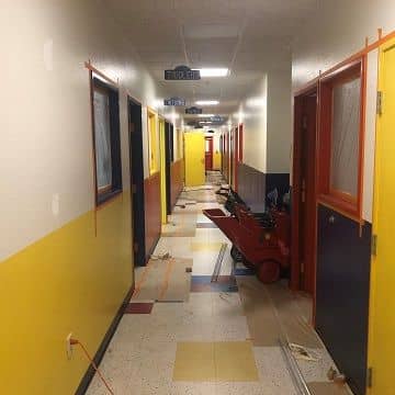 long hallways of a half finished commercial painting job