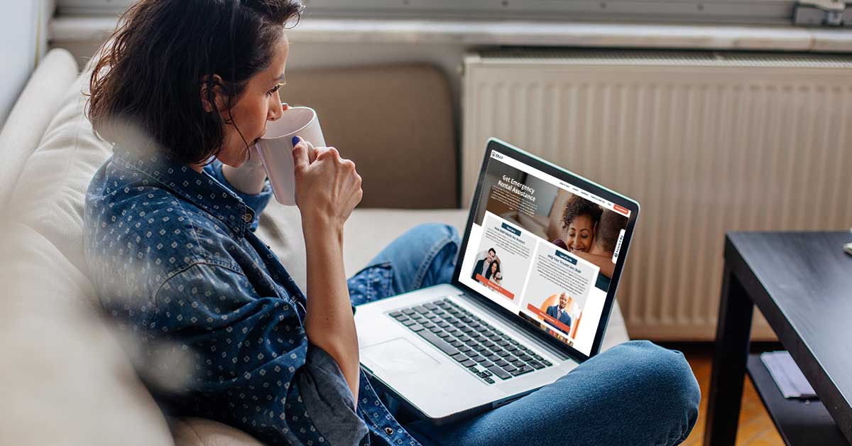 A woman views the Emergency Rental Assistance Program website on her laptop computer.