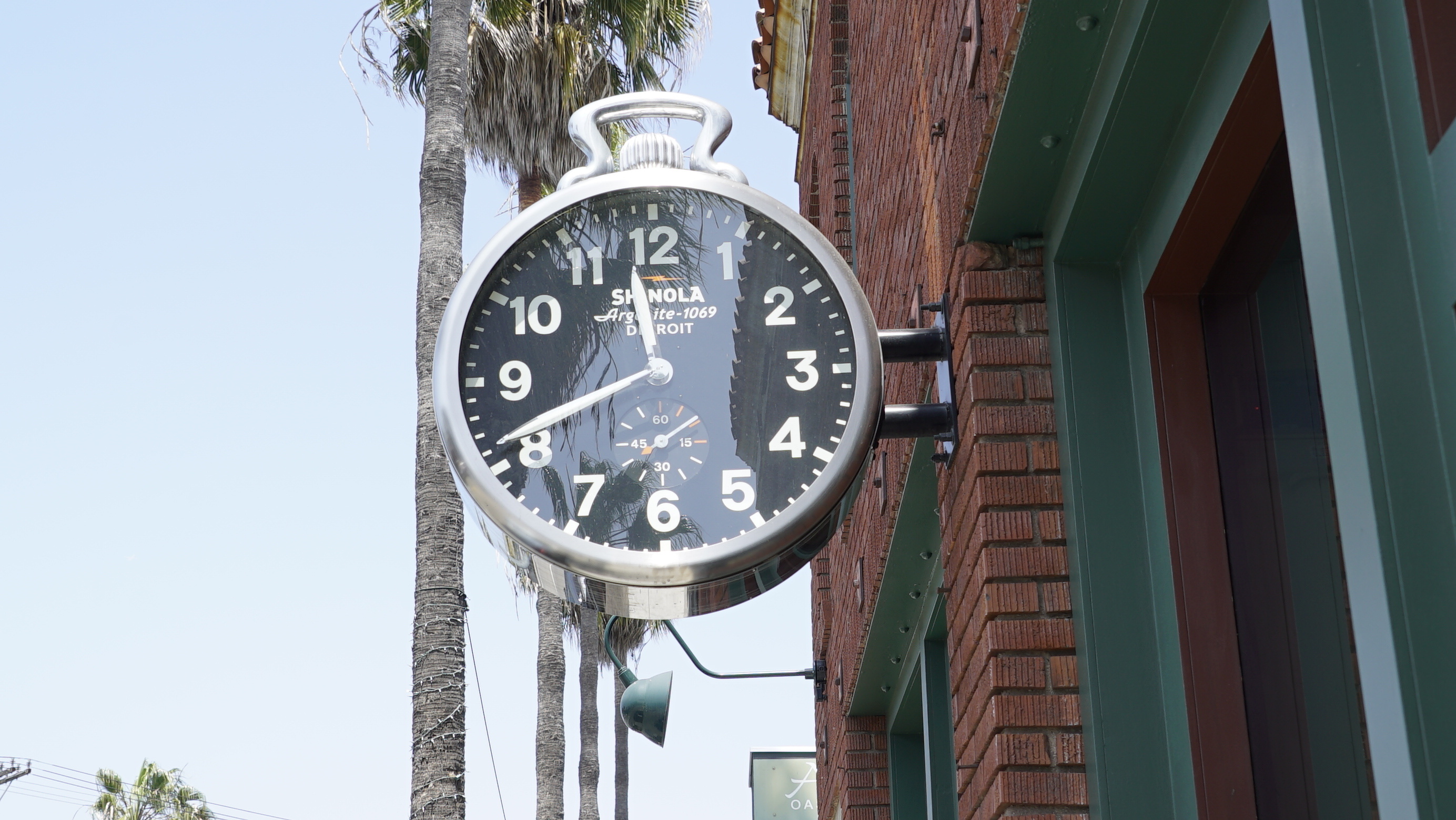 clock sign outside of shinola 