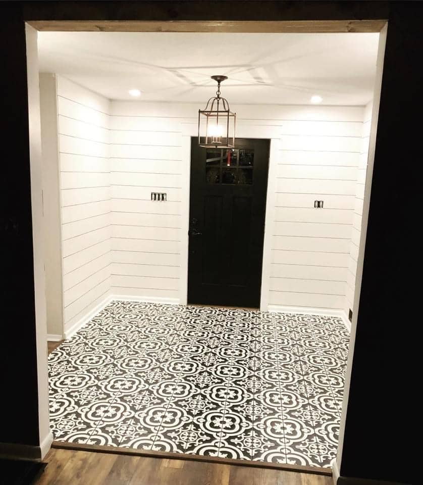 enlarged photo white shiplap painted walls with a black and white mosaic tile floor