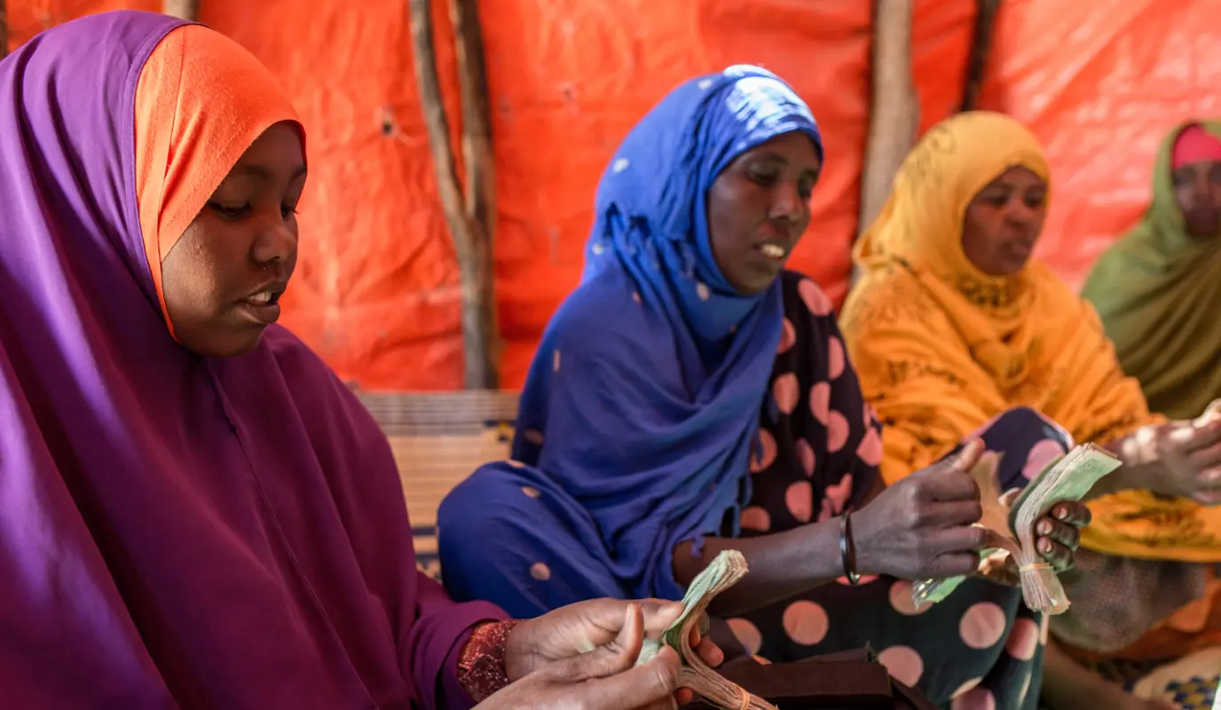 Fowzia Hassan (pictured on the left in purple) is part of a women's self-help group in Somalia.