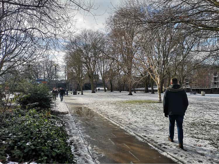 Myself walking on the snowy path through a park in the middle of York.