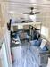 Gooseneck tiny house from Greensburg, PA; 'aerial' shot of the interior showing the space bedroom area and double seater couch. Gooseneck tiny house from Greensburg, PA; 'aerial' shot of the interior showing the space bedroom area and double seater couch.