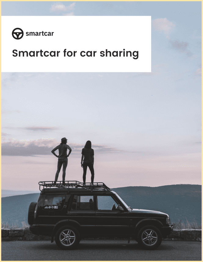 Front-page of Smartcar’s car sharing white paper showing two people standing on an SUV in a mountainous sunset landscape