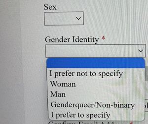 A screenshot of a website with a blank form field for &quot;Sex&quot;, and a form field for &quot;Gender Identity&quot; with dropdown options for &quot;I prefer not to specify&quot;, &quot;Male&quot;, &quot;Female&quot;, &quot;Genderqueer/Non-binary&quot;, &quot;I prefer to specify&quot;