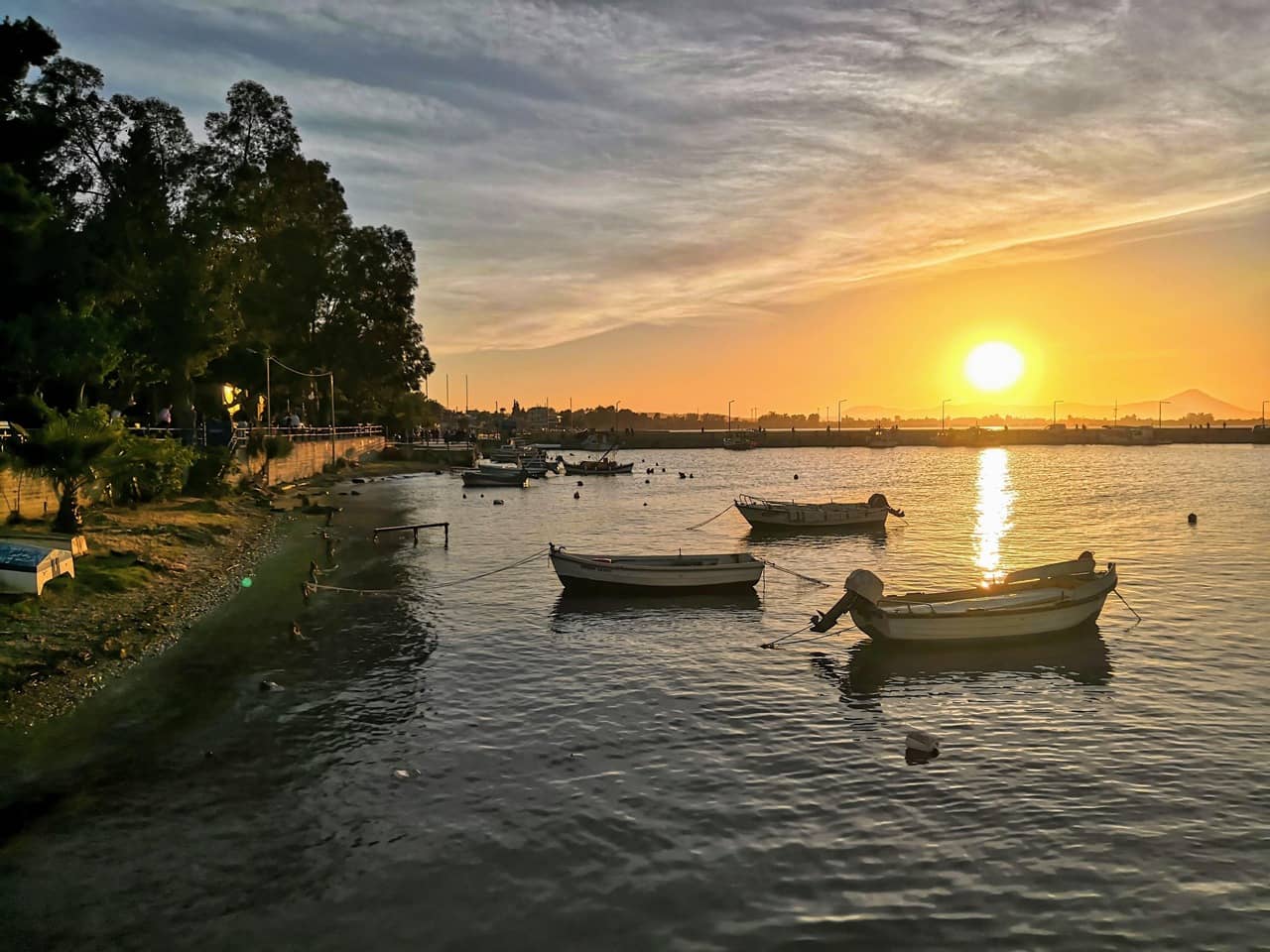 Sunset view with parked fishing boats