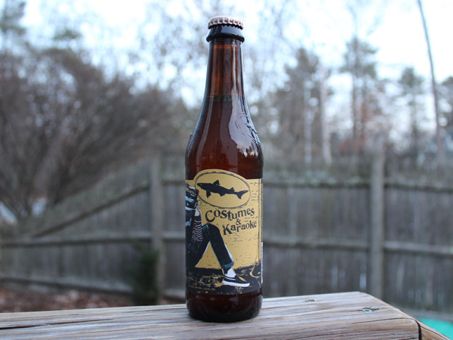 Costumes & Karaoke, a Golden Tea Inspired Oat-Cream Ale brewed by Dogfish Head Craft Brewery