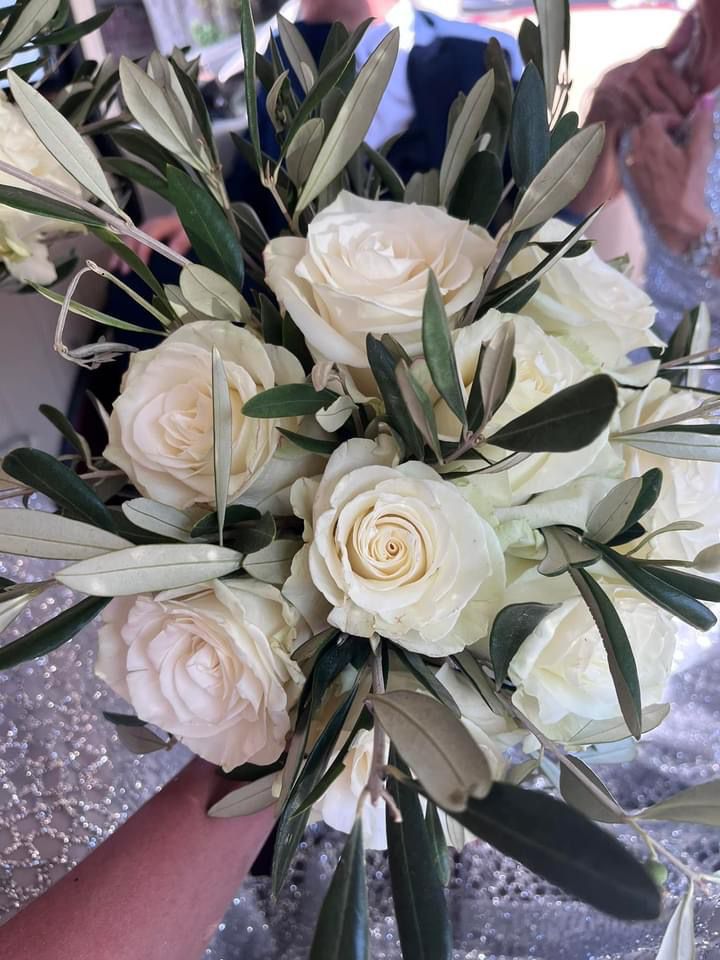 white roses in flower bunch at wedding venue