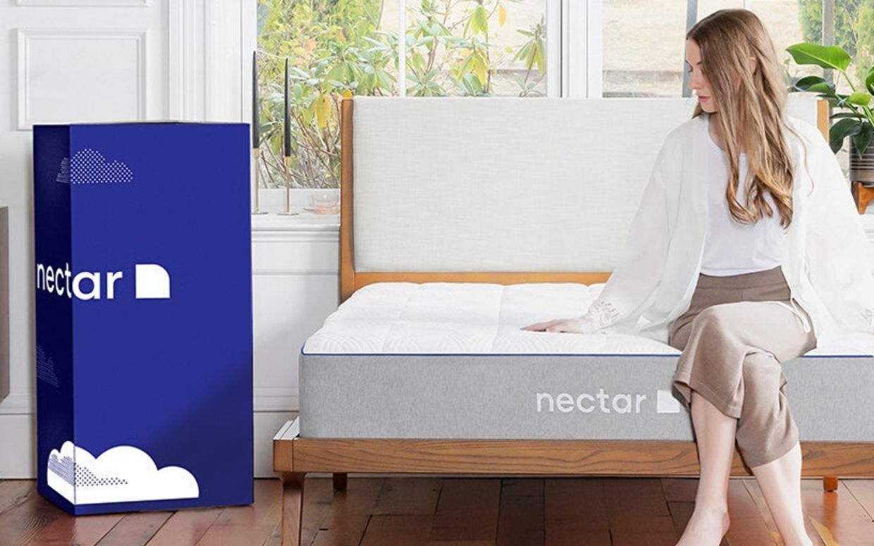 woman on nectar memory foam mattress in bedroom