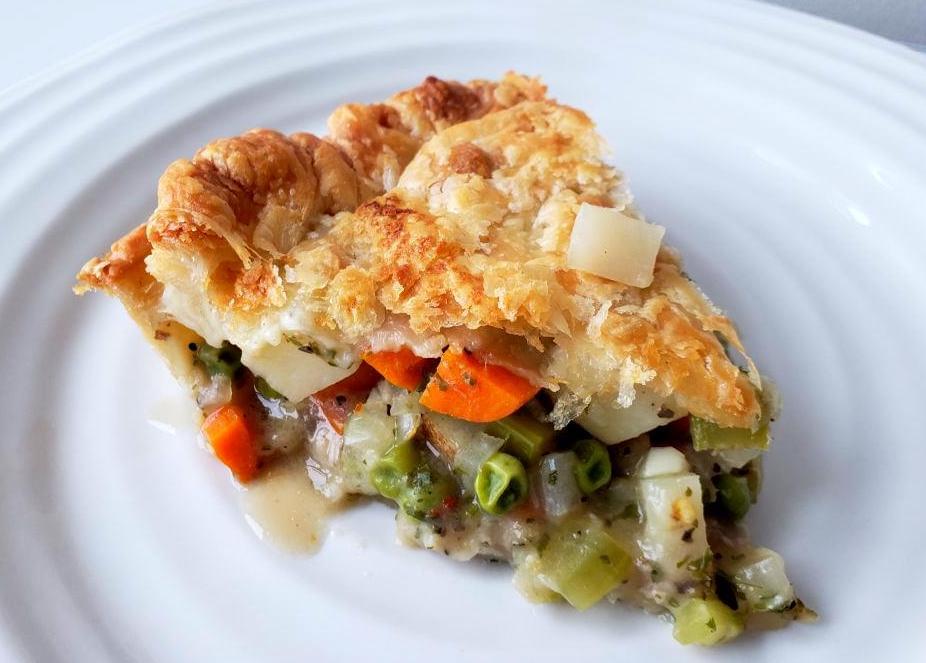 Plate with slice of vegetable pot pie