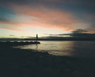 Silhouette of a man against the setting sun
