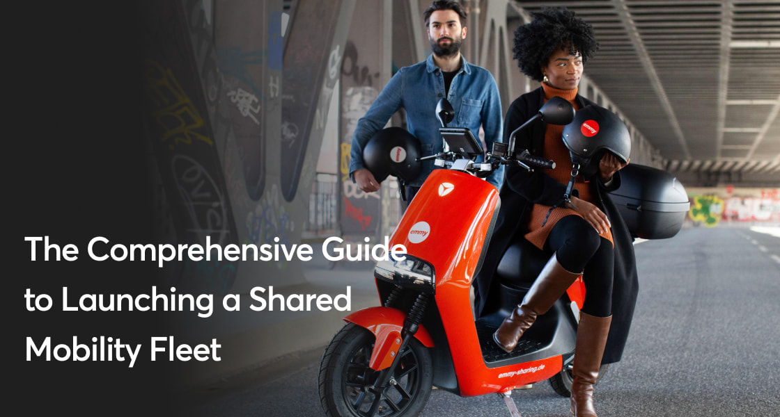 Template titled "The comprehensive Guide to Launching a Shared Mobility Fleet" with a background image of Devran and Julie standing and sitting on a bridge with an emmy e-scooter.