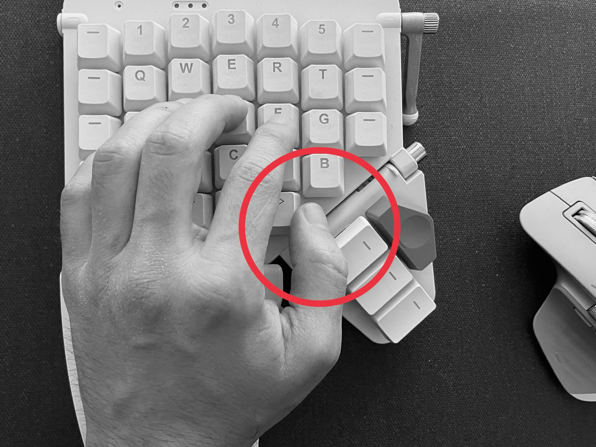 In the natural position of the arm, the thumb rests in between the keys