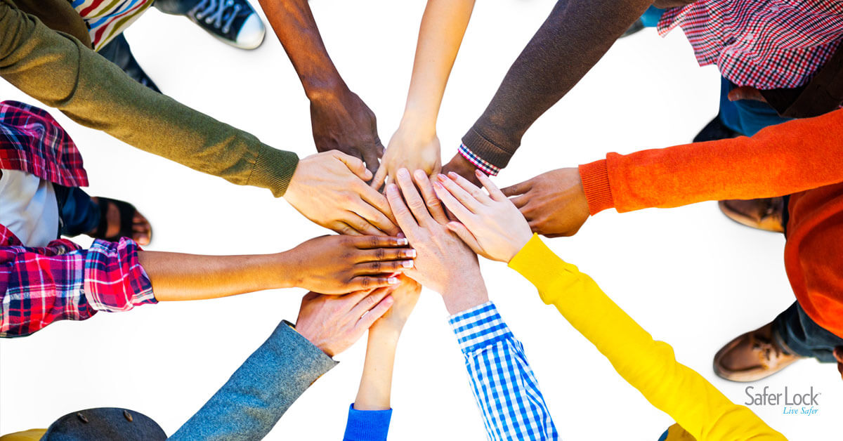 A diverse group of hands lending each other support.