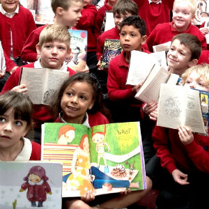 School children with books in a library