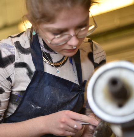 Francesca at work on the lathe.