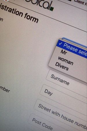 A photo of an online form with a selection with options "Please select", "Mr", "woman", "Divers"
