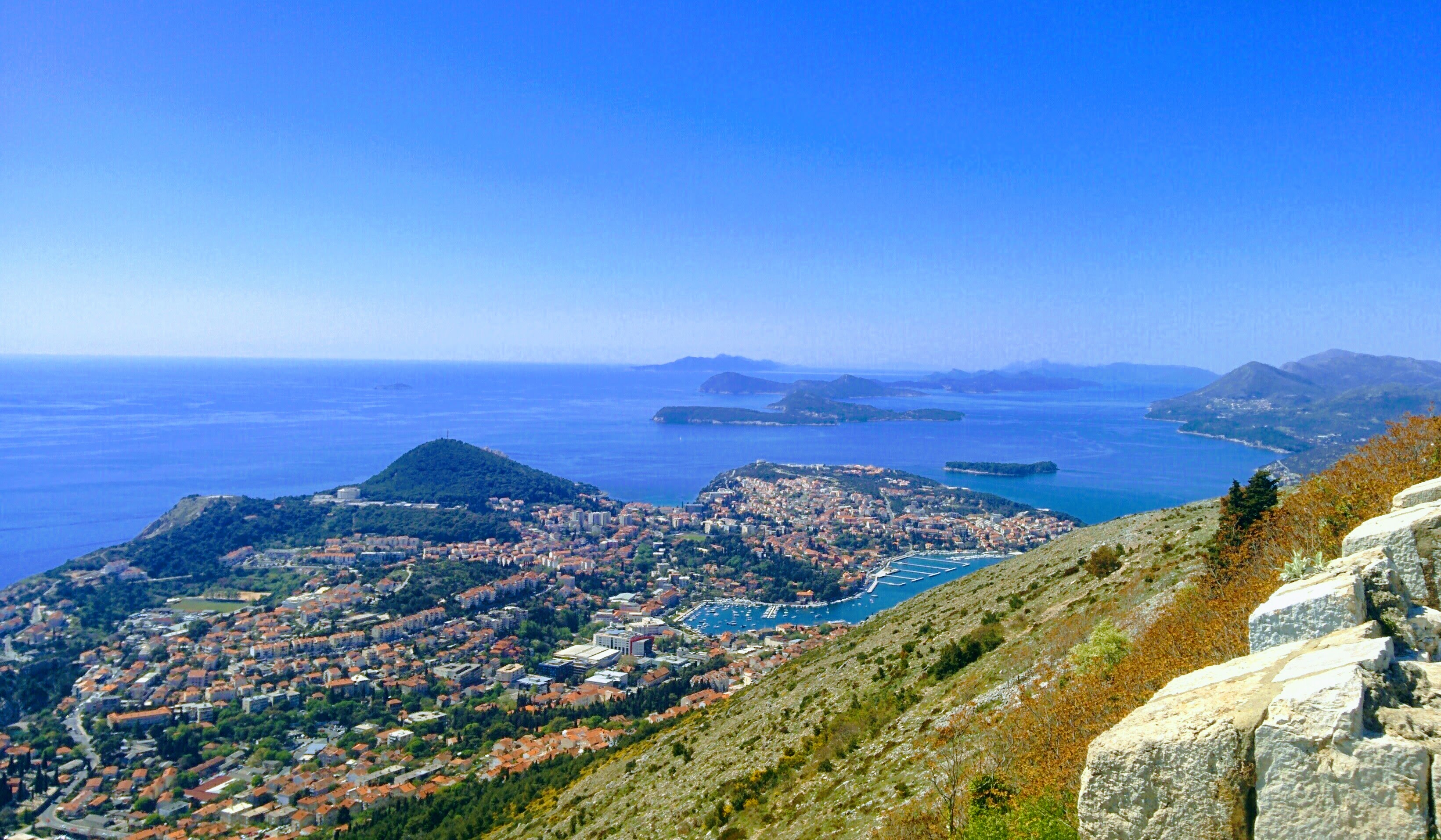 Dubrovnik coastline with view of the sea and terracotta rooftops.