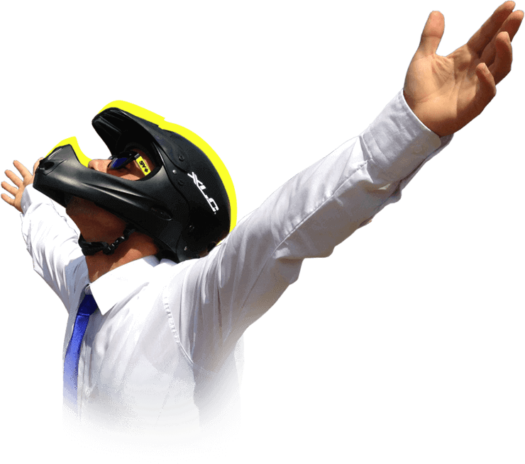 A photo of Yasin with suit and downhill helmet