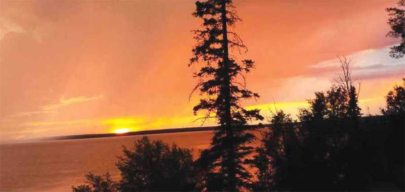 Sunrise over lake in Waskesiu Saskatchewan Sunrise over lake in Waskesiu Saskatchewan