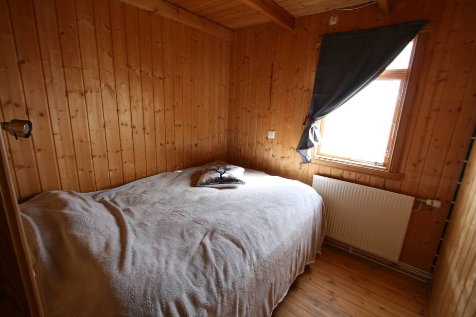 Scandinavian style bedroom with a double bed Mývatn