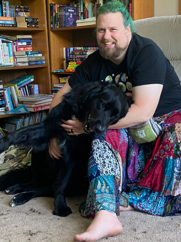Photograph of Aaron with his dog