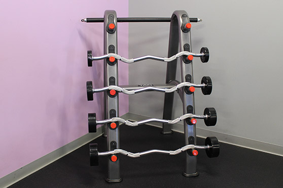 Rack with several barbells.