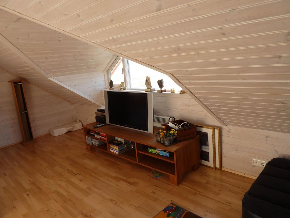Flatscreen TV is located in the converted attic.
