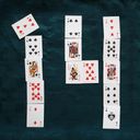Tiny playing cards arranged to form the digits one and four.