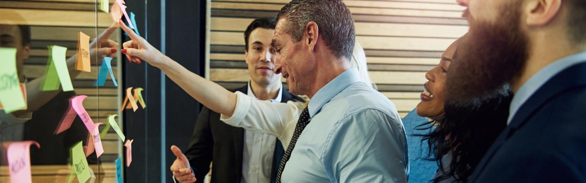 image showing a business team in a scrum meeting