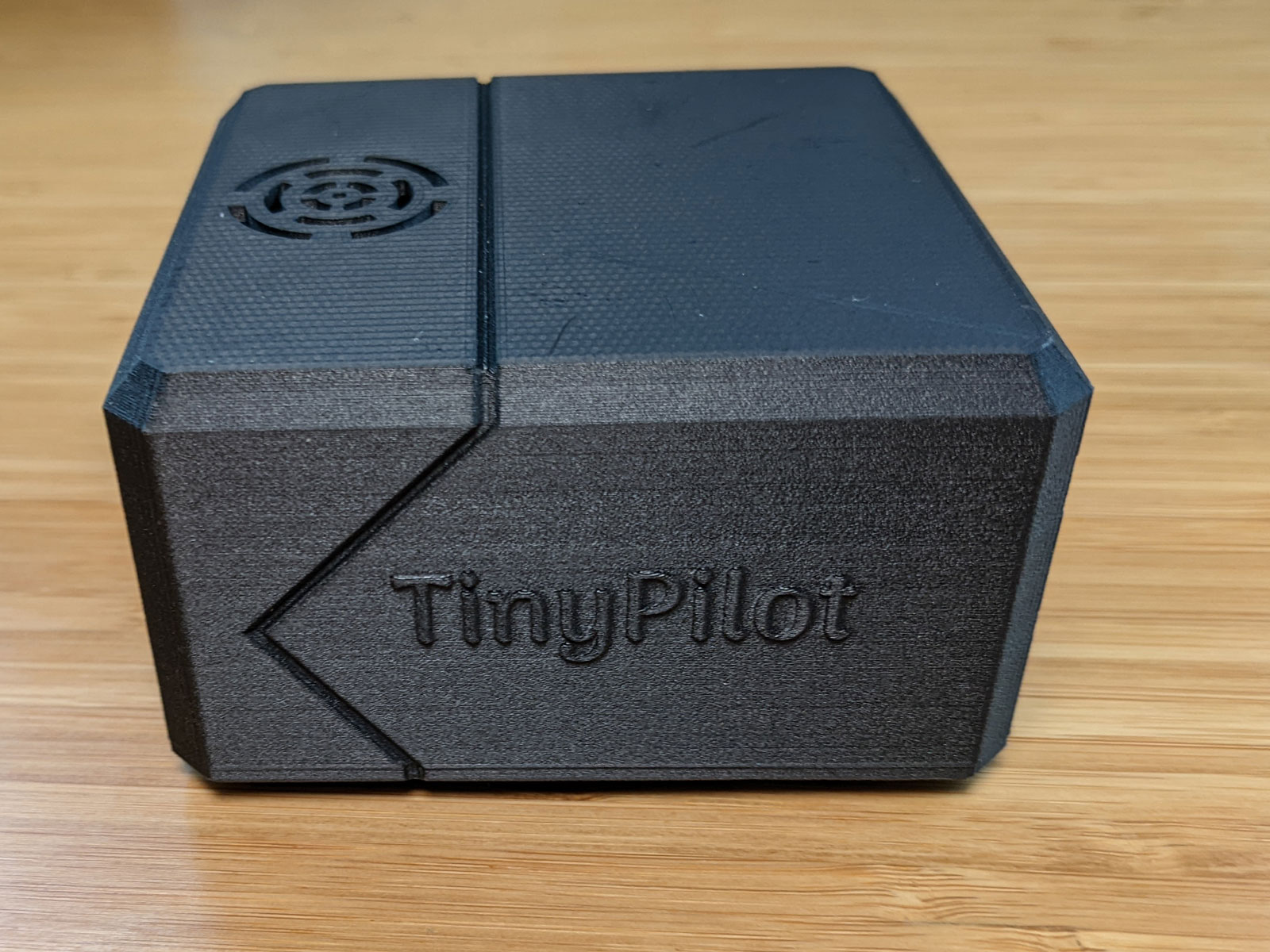 Photo of TinyPilot Voyager from the side with TinyPilot brand name showing