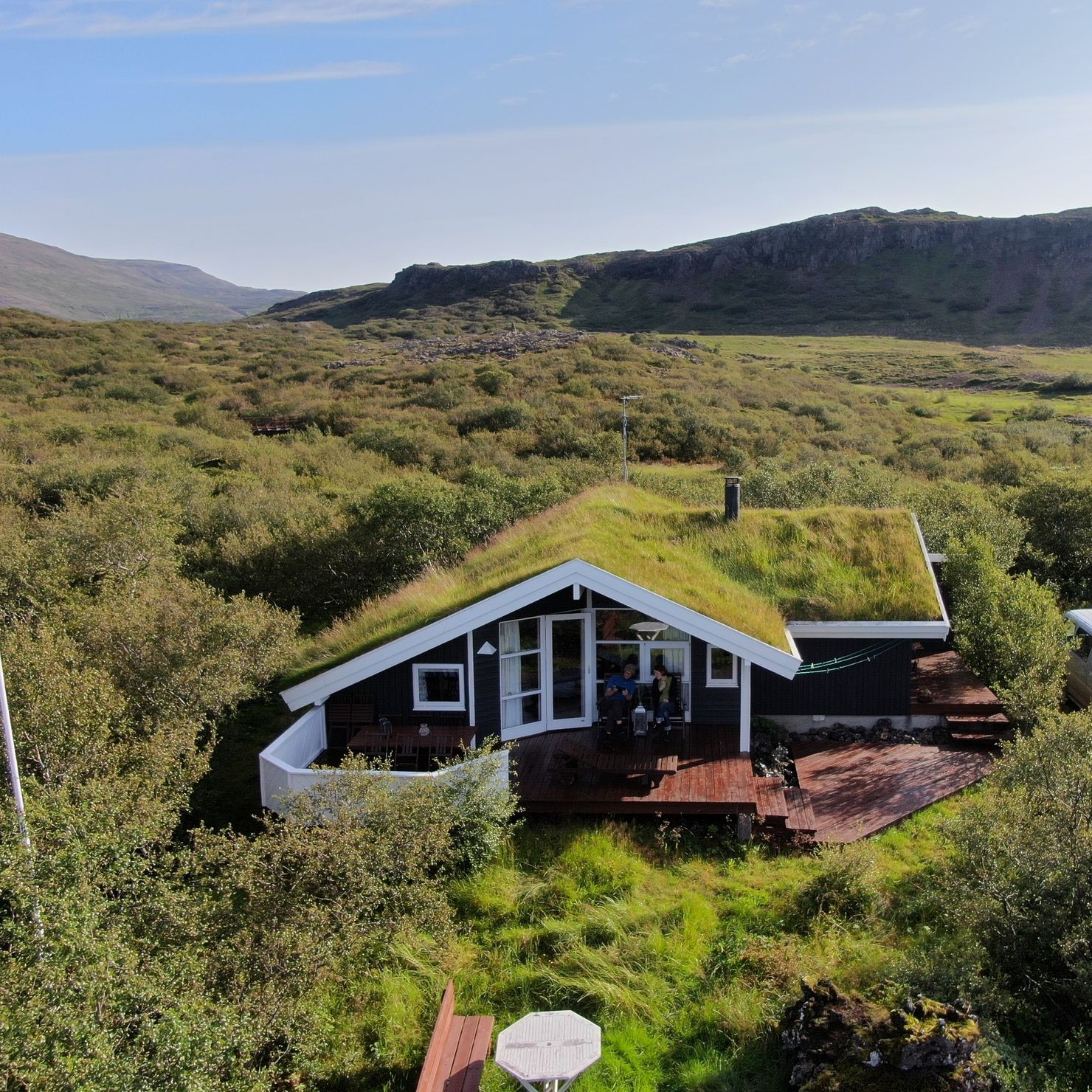 The peat-roofed cottage is situated in a forest and is perfect for a family