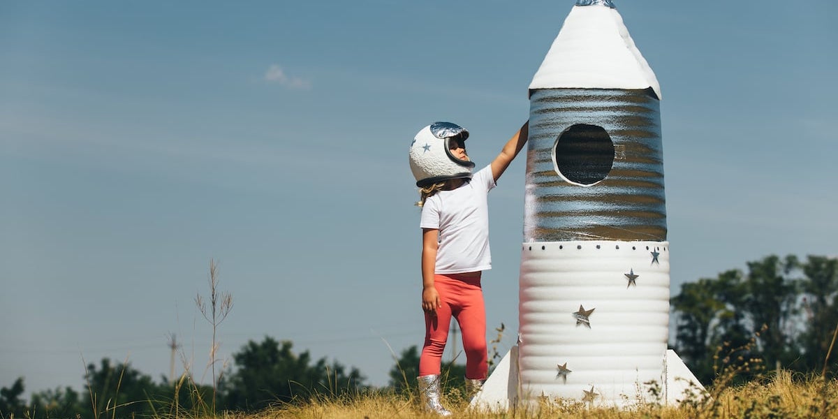 Girl dressed as astronaut with a toy rocket The next generation of tech whizz kids