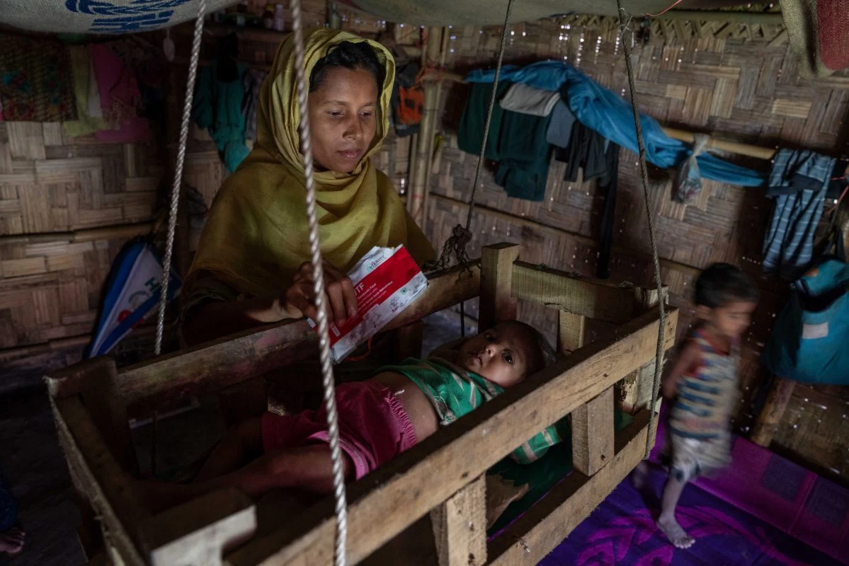 A mother and children in a Rohingya refugee camp