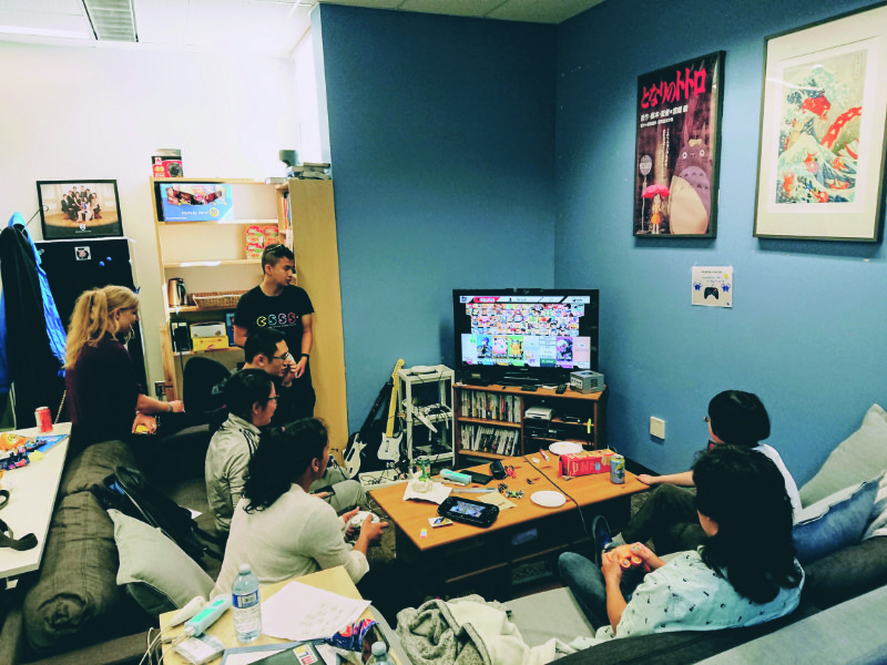 People playing Super Smash Bros in the Cube lounge