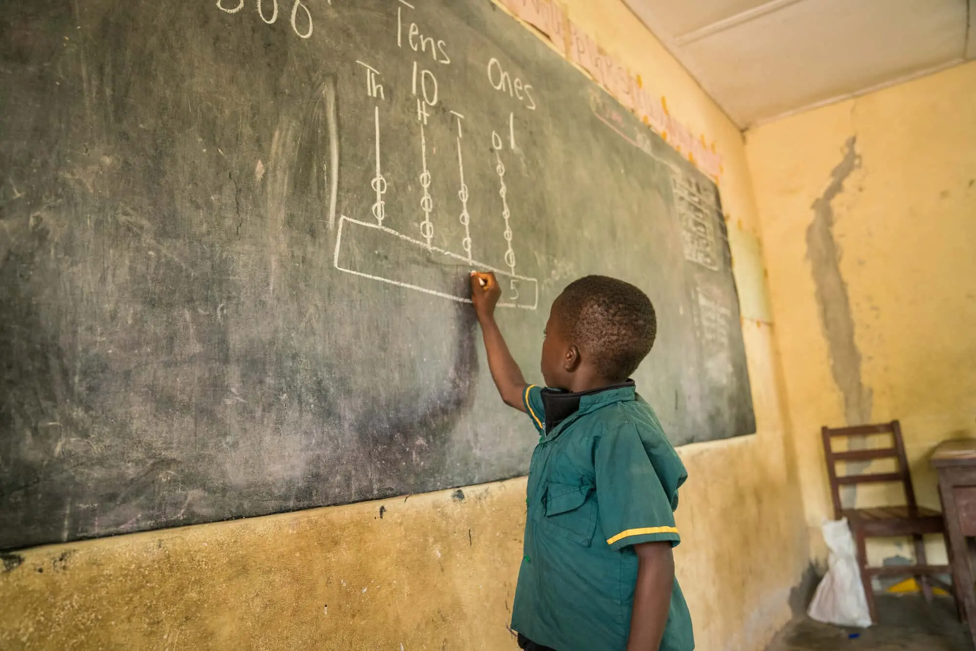 Boy at blackboard in Sierra Leone