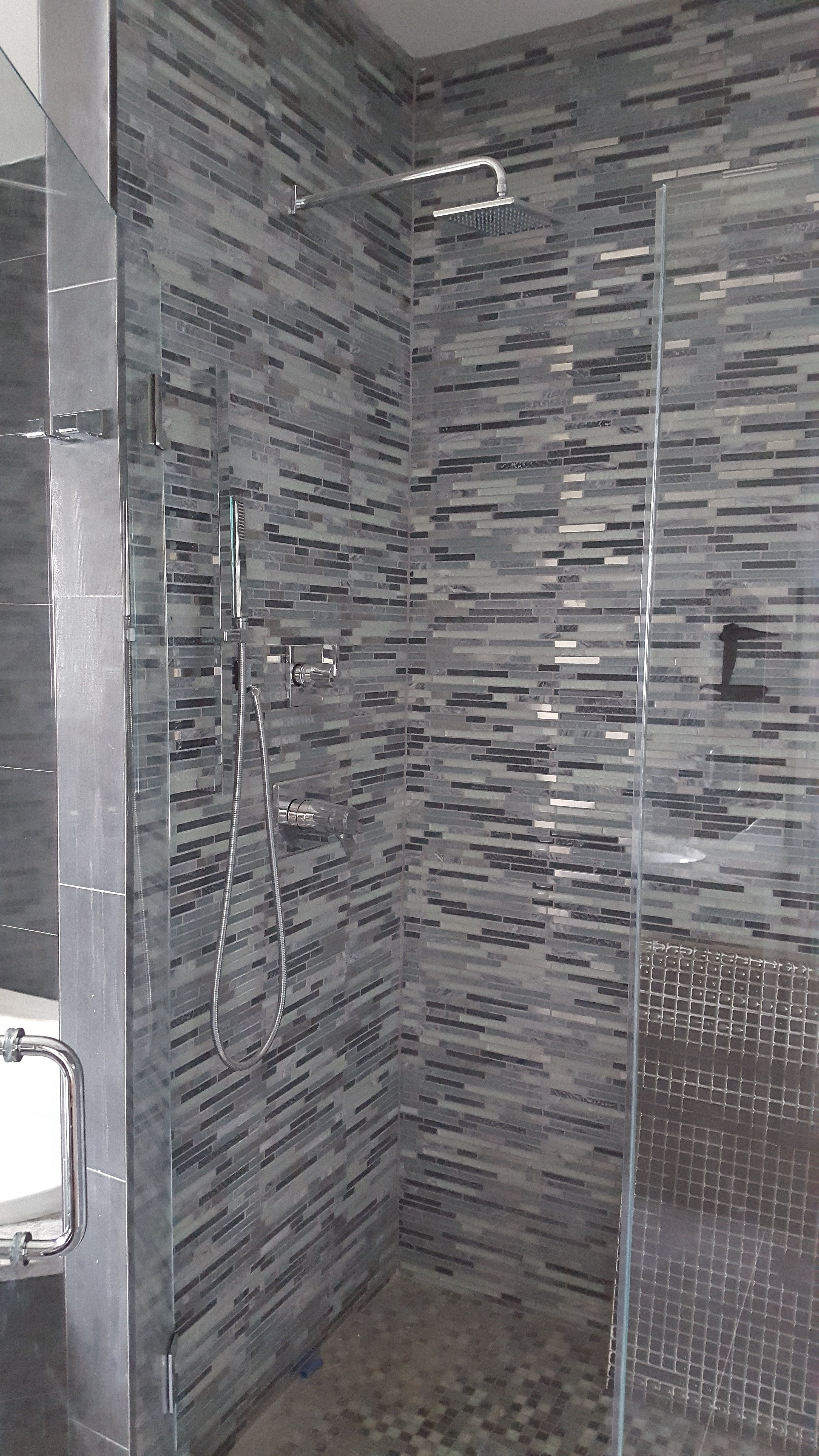 Custom completed Shower with elegant backsplash by Dream Concepts Contracting LLC.