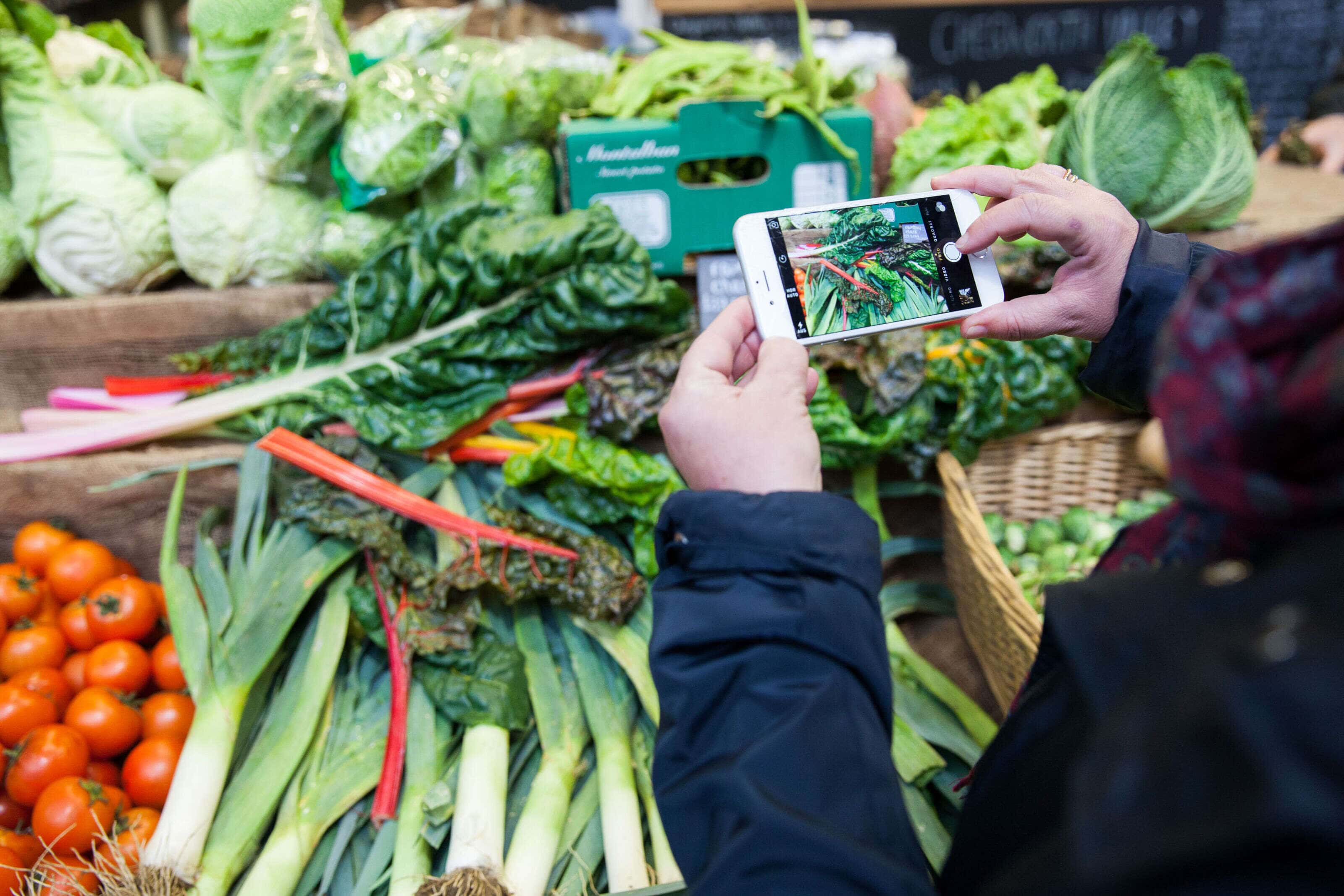 image of an iphone screen taking an image of veg and fruit.