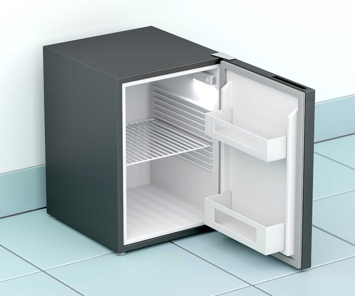 An open mini fridge on blue tile
