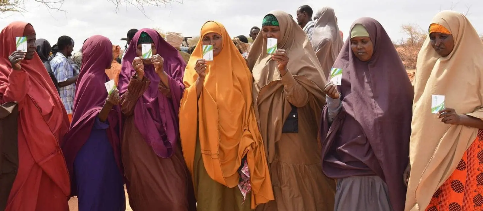 Somali women holing up SIM cards used for cash transfers.