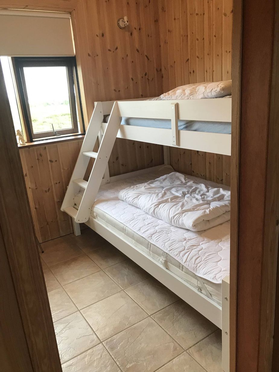 Bedroom with a bunk bed lovely holiday home south Iceland