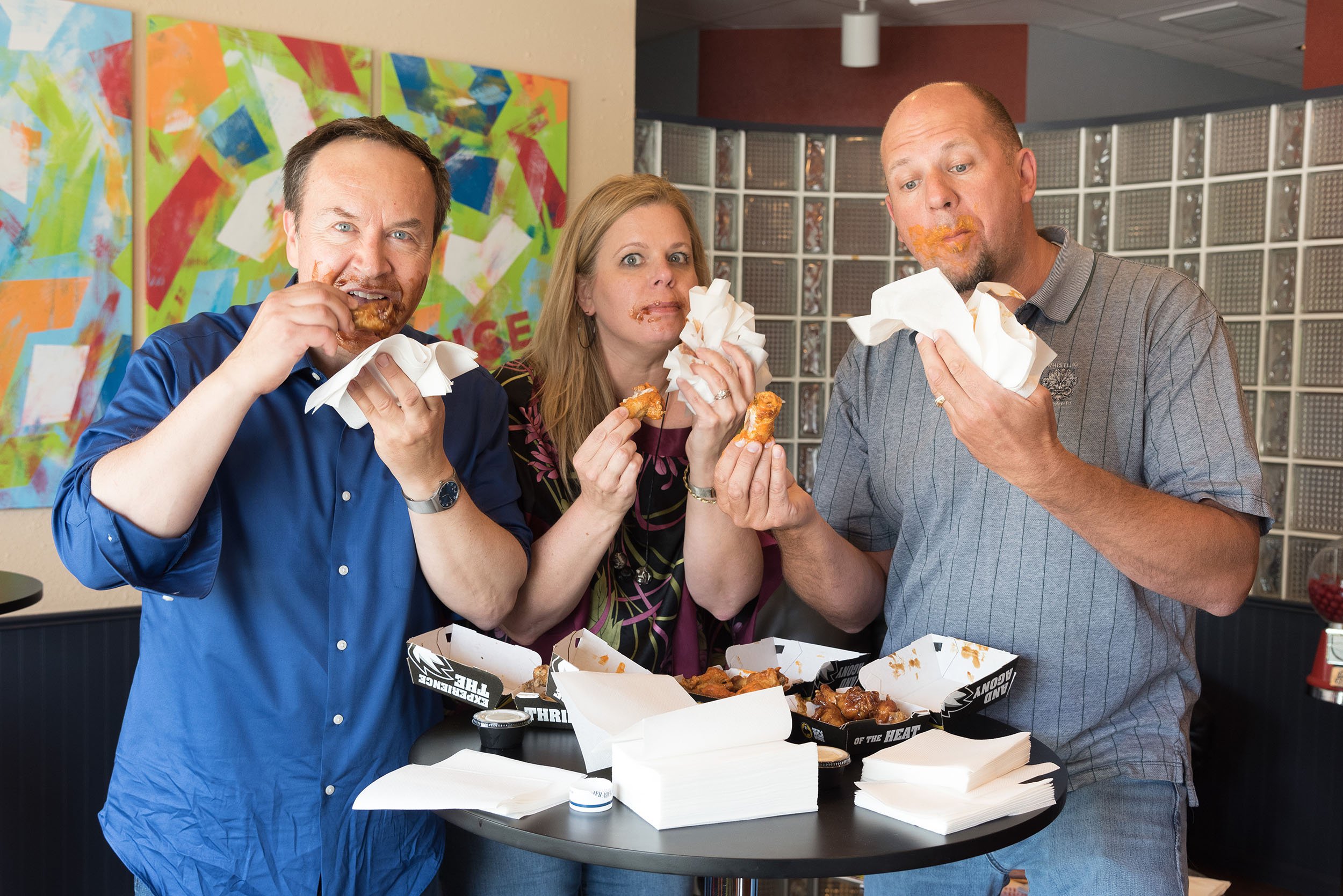 Portrait of group eating wings