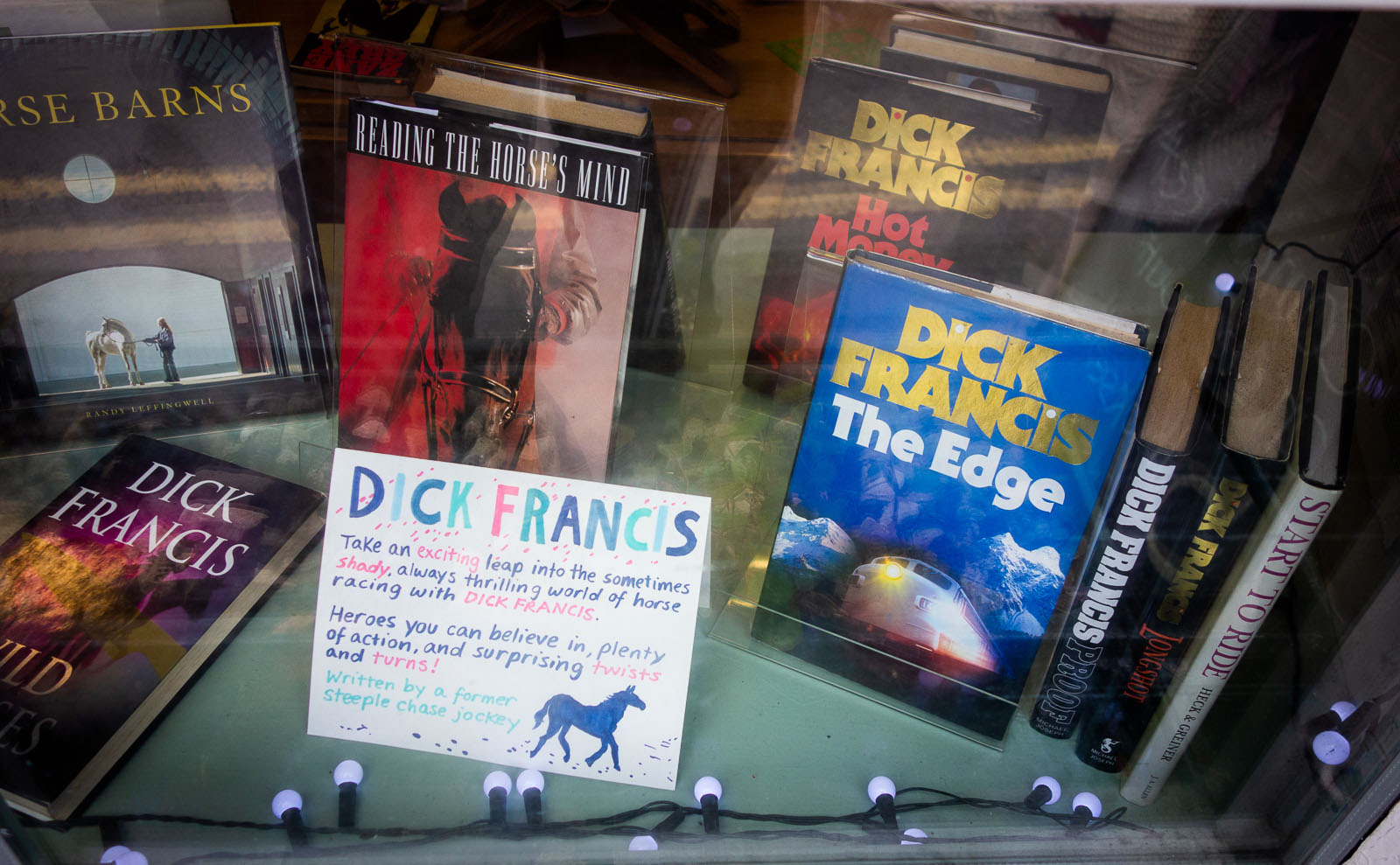 a window display of dick francis novels