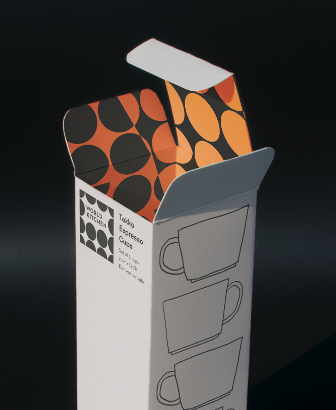 Tall white box open showing a brightly colored orange and black pattern on the inside