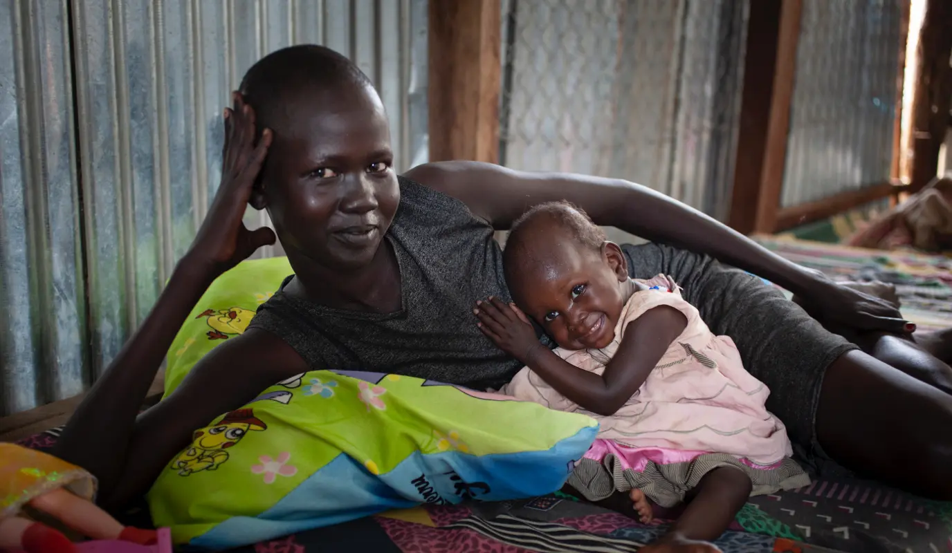 Nyabila*, a single mother, and her daughter Athieu* in a Protection of Civilians (POC) site in South Sudan.