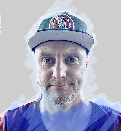 Headshot of Chris Pearce wearing a baseball cap