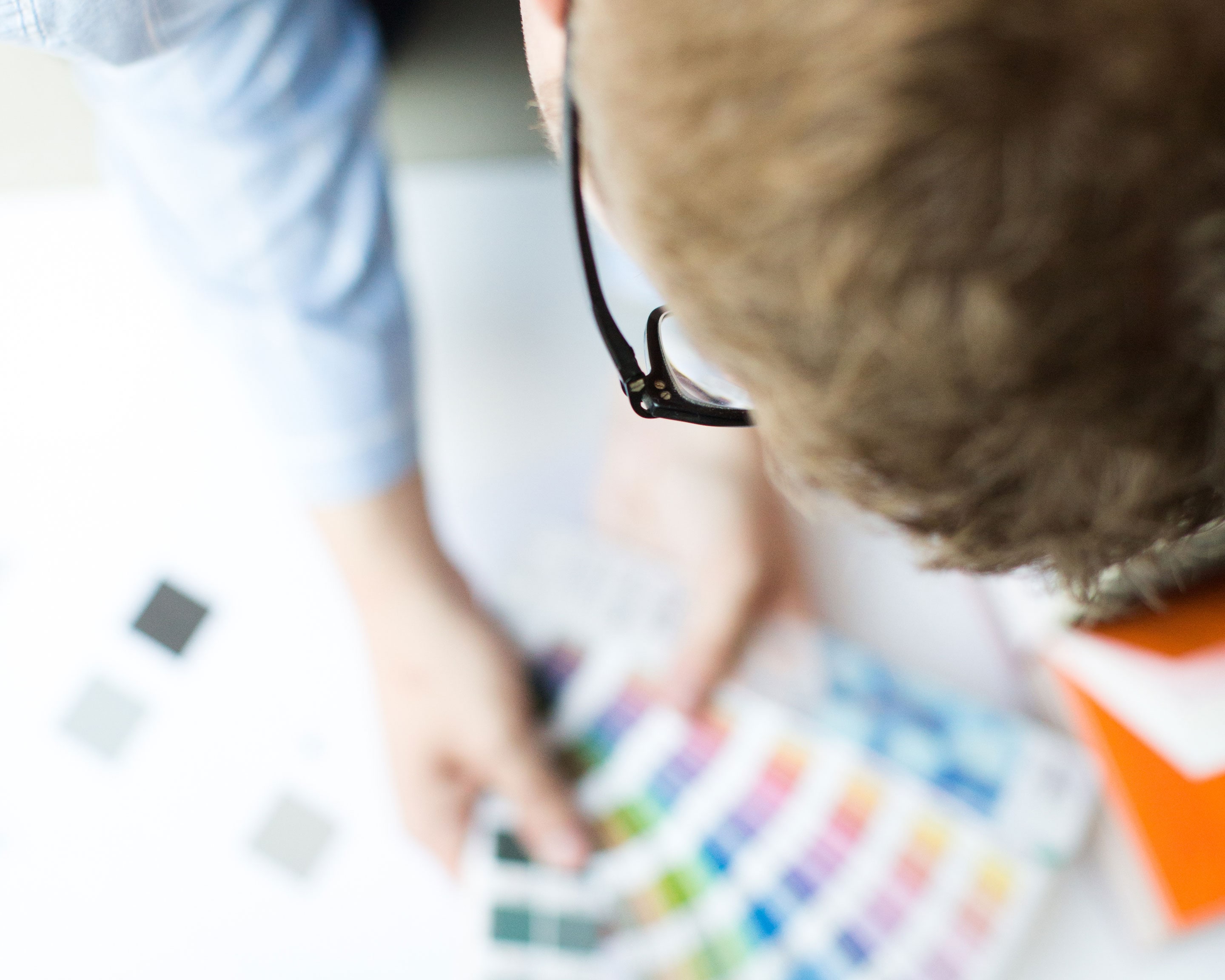 Overhead shot of Jack Watkins holding Pantone swatches