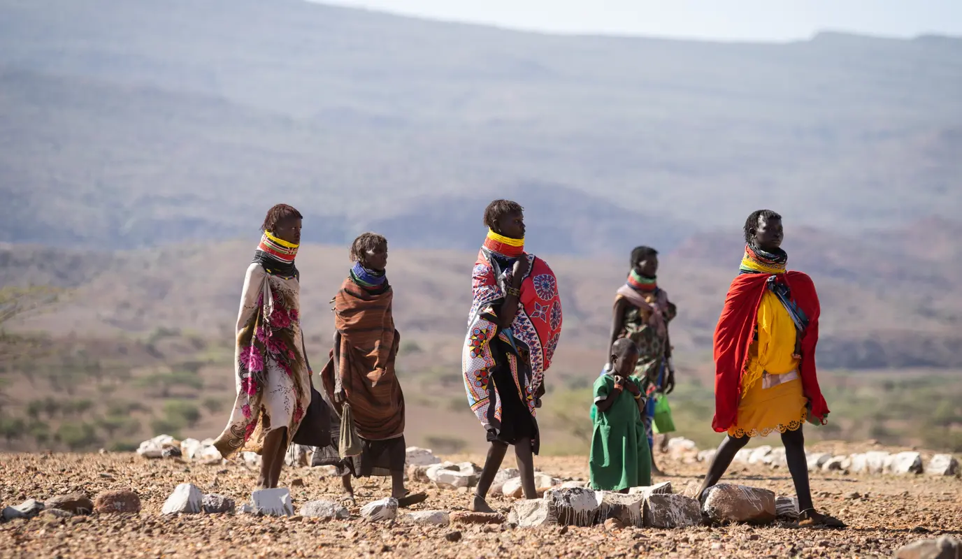women and children in arid landscape